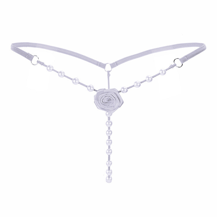 Low-rise crotchless transparent rose thong