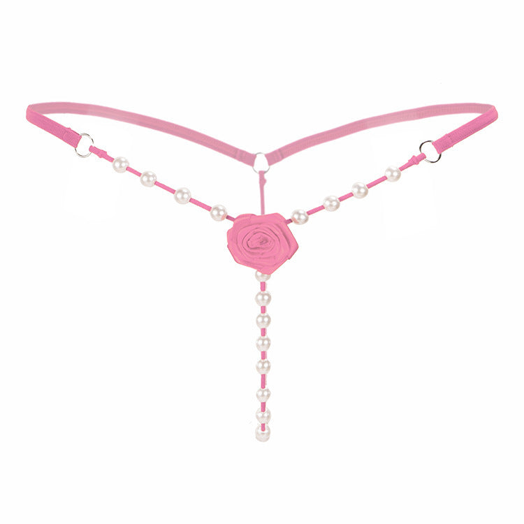Low-rise crotchless transparent rose thong